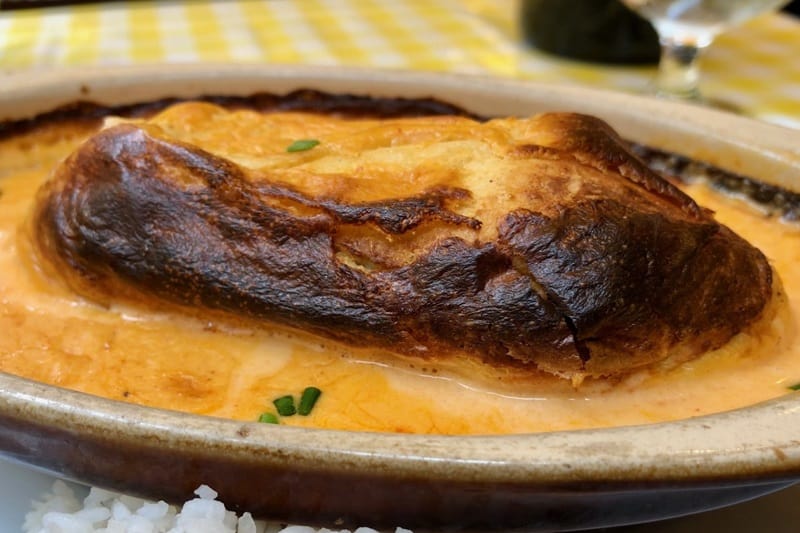 Quenelles de brochet, fish dumplings in a savory seafood sauce, are one of the favorite dishes on a Lyon food tour.